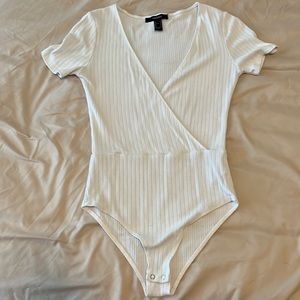 White v-neck body suite. Size small.
